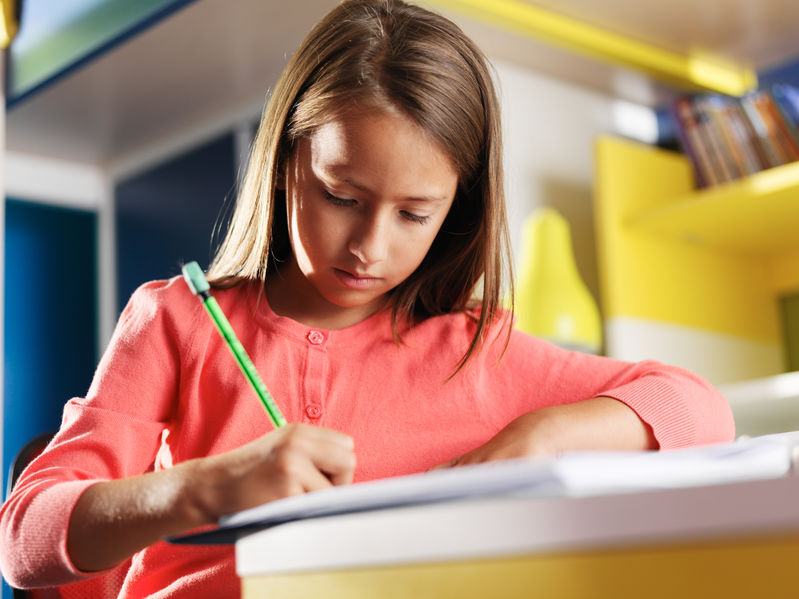 Handwriting lessons page with image of girl writing positioned in the header